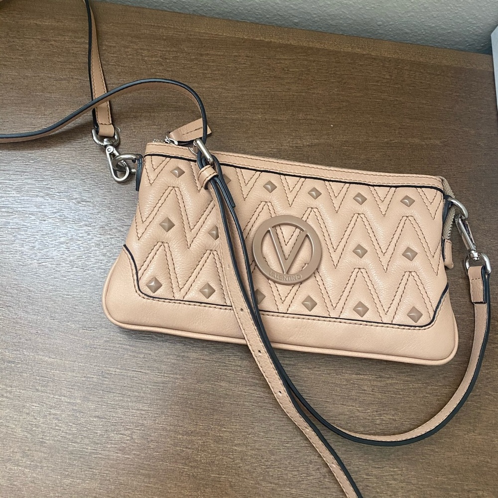 In excellent condition. Two straps included. Can be shoulder bag or crossbody.